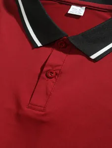 Macro view showing the collar detail and fabric texture of this red men's polo shirt