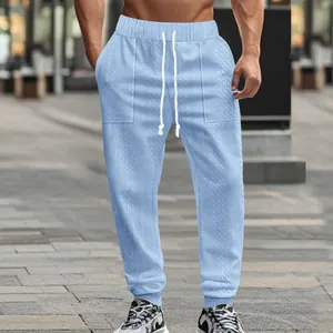 Close-up detail of light blue cable knit drawstring casual jogger sweatpants for men