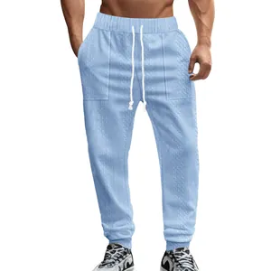 Men's light blue knitted jacquard sports joggers with drawstring waist and ribbed cuffs