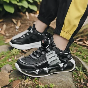 Boys' black athletic running shoes with leather upper and rotating dial buckle