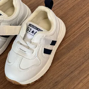 Warm white children's winter sneakers with soft soles for toddlers