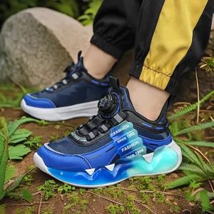 Boys' athletic running shoes featuring a rotary buckle and thick blue cushioned sole.