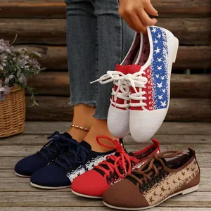 Close-up detail of various colors of breathable women's flyknit lace-up sneakers
