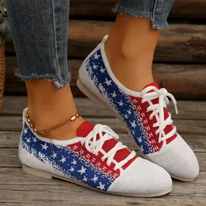 Close-up of stylish flyknit flat sneakers with patriotic star pattern and white laces