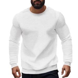 Detailed view of white slim-fit crew neck sweater with small waffle grid pattern