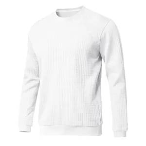 Detailed view of white long sleeve slim fit t-shirt with textured small grid pattern.
