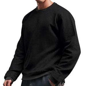 Detailed texture of men's slim fit black waffle knit crewneck sweater