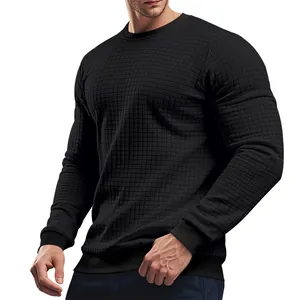 Professional close-up of a black waffle-textured crewneck long-sleeve knitwear top