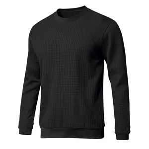 Close-up detail of black slim fit round neck long sleeve shirt with small grid texture
