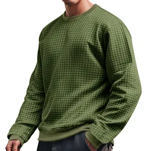 Detail view of olive green waffle knit sweatshirt featuring textured grid pattern