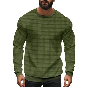 Detail view of men's slim fit waffle knit sweater in olive green with ribbed cuffs