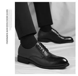 Close-up detail shot of men's black business leather shoes with hand-rubbed texture.