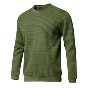 Detail of men's slim fit crew neck long sleeve shirt with olive green grid texture