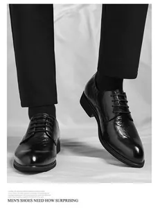 Close-up of black men's business leather shoes with unique hand-grabbed grain texture
