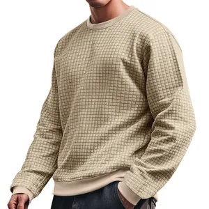 Close-up of men's beige waffle knit crew neck long sleeve t-shirt showing texture