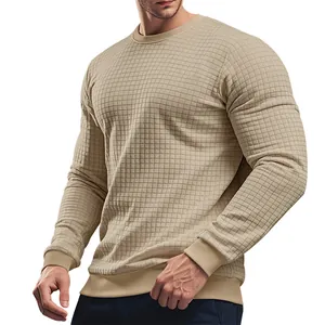 Close-up of beige waffle knit texture on men's slim fit crewneck long sleeve T-shirt