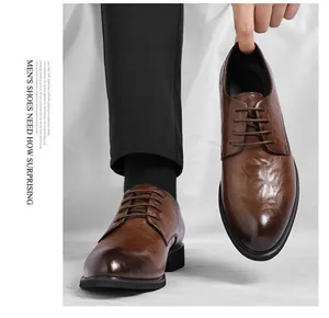 Classic vintage brown hand-textured men's business dress shoes with a pointed toe