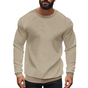 Detail of men's slim fit round neck sweater with beige small waffle grid texture.