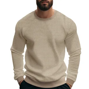 Close-up of the textured checkered pattern on men's long sleeve beige sweatshirt