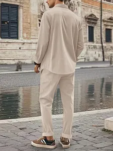 Back view of a men's beige corduroy casual shirt and trousers set on a stone urban street.