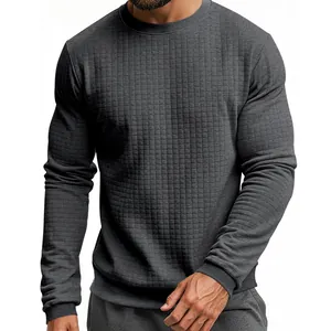 Close-up of dark gray men's long sleeve T-shirt with intricate small grid texture detail