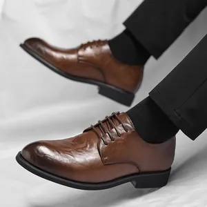 Men's vintage brown leather dress shoes with hand-rubbed texture and pointed toe design