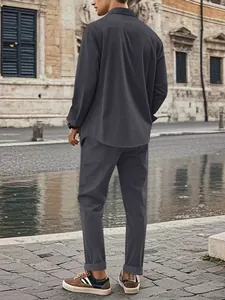 Men's charcoal grey corduroy shirt and pants set seen from the back in street setting