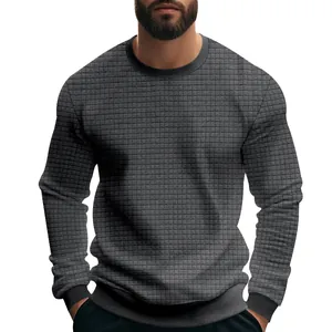 Detailed texture of men's charcoal grey long-sleeve slim fit grid knit sweater