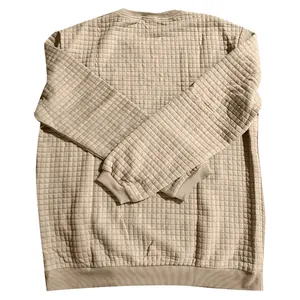 Detailed texture view of men's beige quilted round neck long sleeve sweatshirt