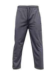 High-resolution detail of dark grey corduroy men's trousers with drawstring waist