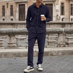Close-up detail of navy blue corduroy men's shirt and pants set in casual street style.
