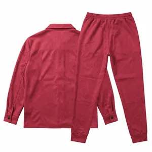 Macro view of men's burgundy suede tracksuit set including jacket and matching trousers
