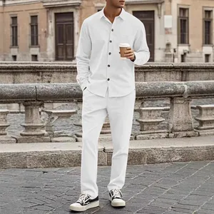 Full view of men's white corduroy casual shirt and pants set on a model outdoors.