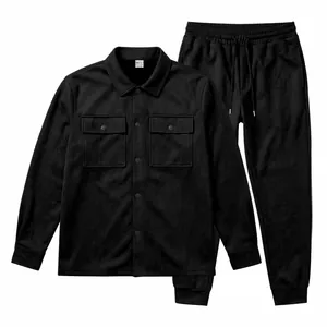 A flat lay showcasing a black faux suede shirt-jacket and matching jogger pants
