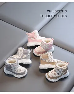 Detailed view of children's fleece-lined winter snow boots with cute bear patterns