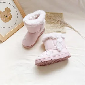 Side view of pink girls snow boots with heart embroidery and fluffy fur lining