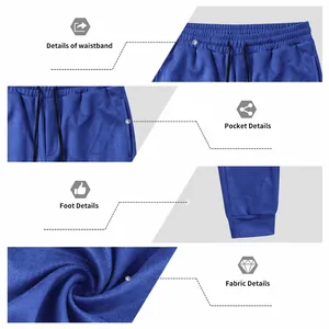 Close-up showing the suede fabric, waistband, and pocket details of blue joggers.