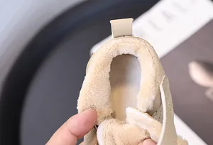 Close-up detail showing the soft and warm thick plush lining of toddler winter walking shoes