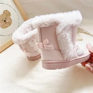 Pink faux fur lined girls' snow boots featuring a decorative bow and heart embroidery.