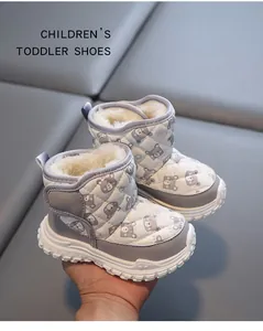 Detailed view of fleece-lined winter snow boots for toddlers with cute bear pattern