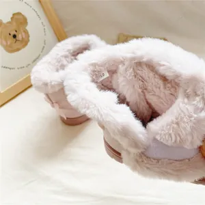 Close-up detail showing the soft and thick faux fur lining of pink girl winter snow boots.