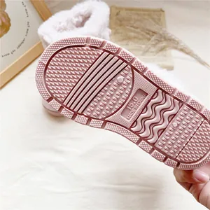 Detailed view of the anti-slip sole on pink warm thickened snow boots for girls