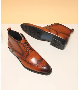 High-angle view of brown leather Brogue boots showing wingtip detail and grip sole