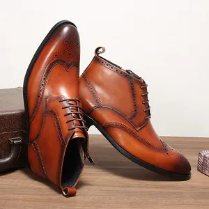 Detailed view of brown leather Brogue Martin boots with intricate carved patterns.