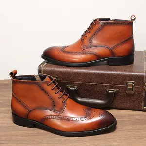 Vintage tan leather wingtip brogue boots with side zipper and lace-up closure for men