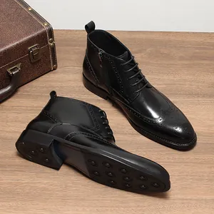 Detail of black leather Brogue boots with side zipper and textured anti-slip outsole.