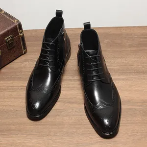 Detail of men's black leather wingtip brogue boots with side zipper and lace-up design