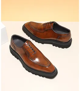 Detailed look at brown polished leather Oxford shoes featuring chunky soles and brogue patterns