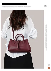 Elegant burgundy pebble leather tote bag with adjustable shoulder strap for women