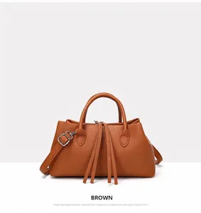 Large brown faux leather tote bag for women with top handles and tassel details